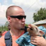 JD delivered pigs to needy families