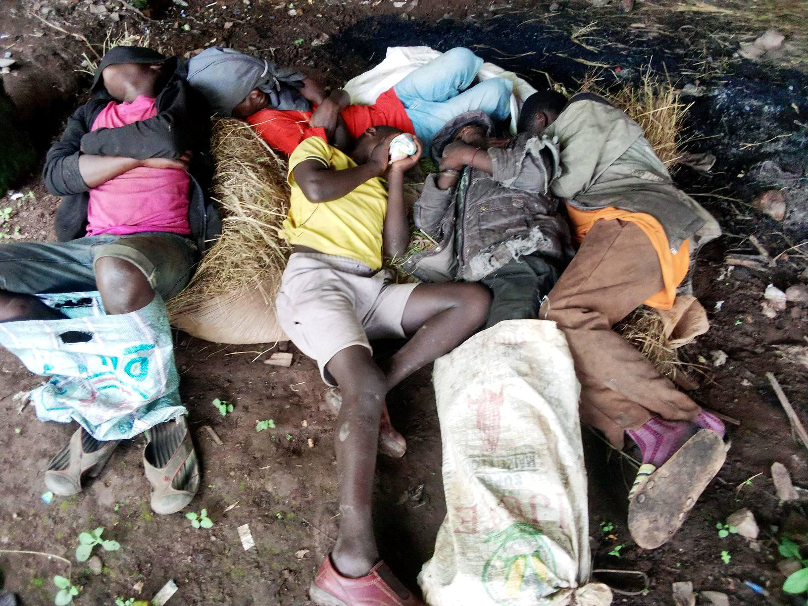 Street kids sleeping with plastic bags to keep warm