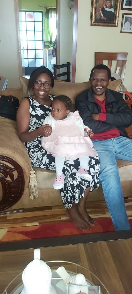 Chala on the lap of her new parents
